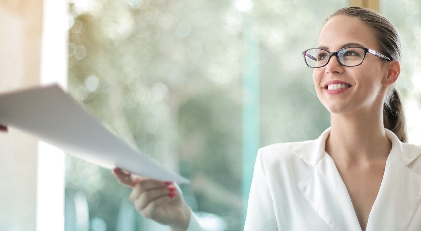 Administrative assistant turning in a report