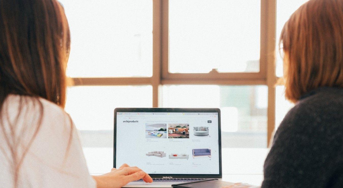 One woman training another on a computer