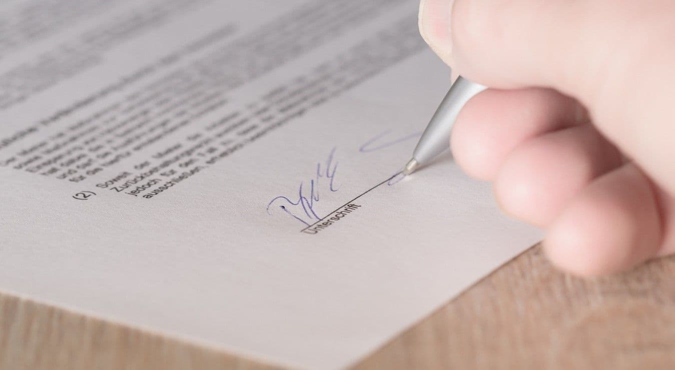 Person signing a contract