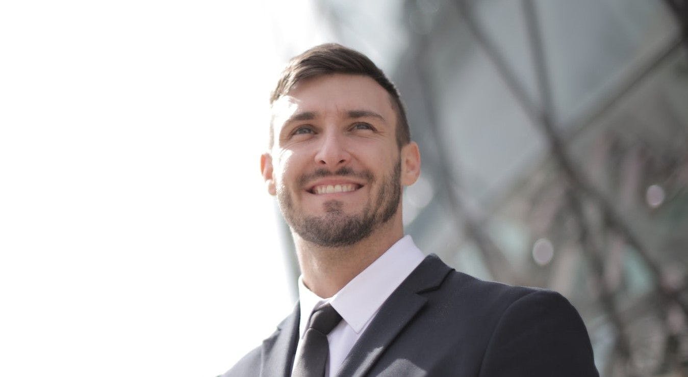 Man in suit smiling