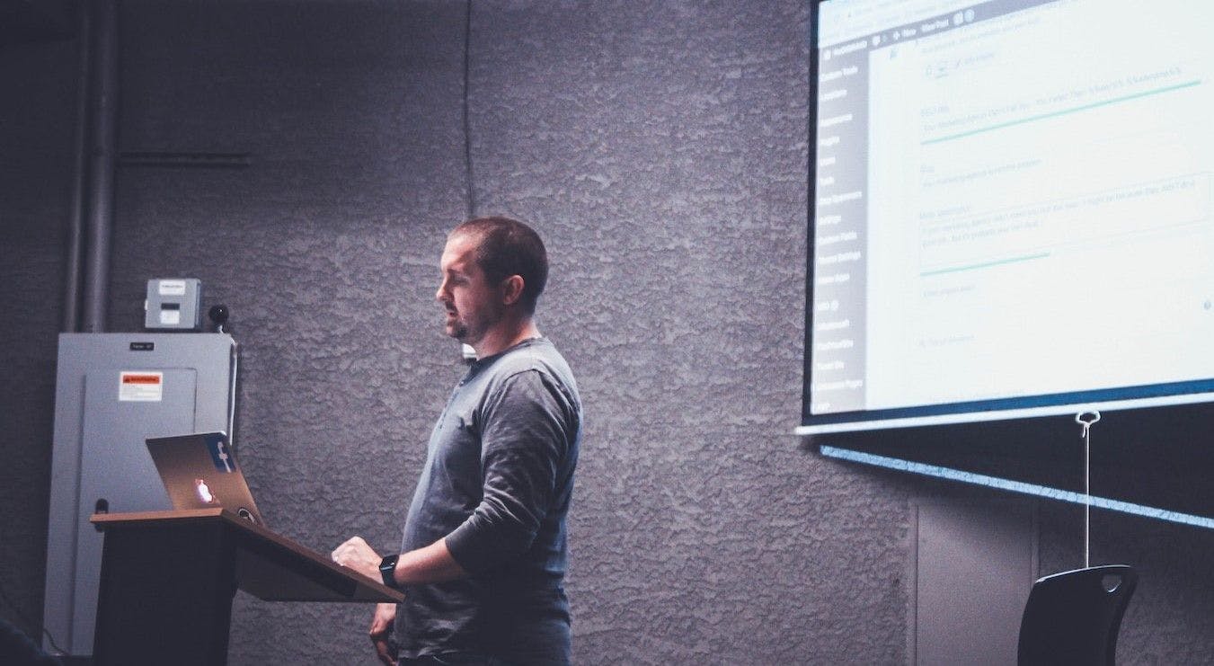 Man presenting information via projector