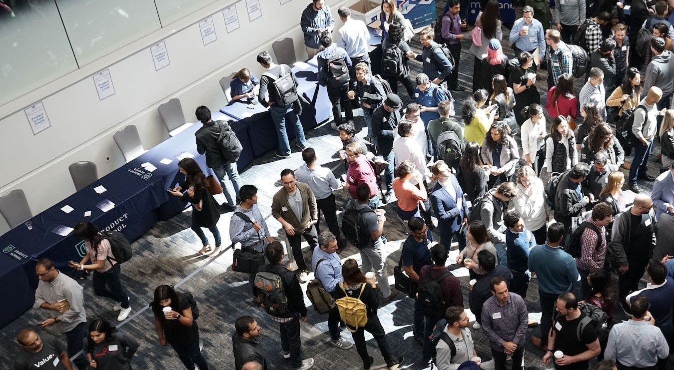 Busy conference lobby with many attendees