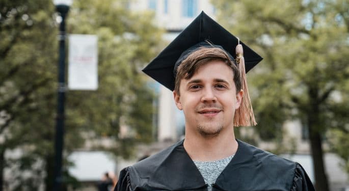 A college graduate in cap and gown.